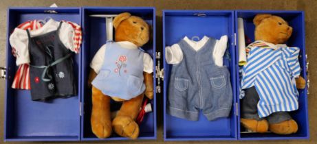 Two Teddy bears in travel boxes