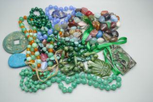 A collection of gemstone bead necklaces including malachite and quartz