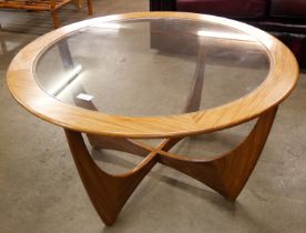 A G-Plan Astro teak and glass topped circular coffee table