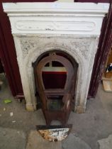 A Victorian cast iron bedroom fire surround