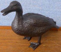 A bronze figure of a duck