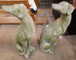 A pair of concrete garden figures of seated hounds