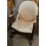 A Victorian mahogany and leather upholstered library chair