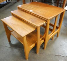 A Stonehill teak nest of tables