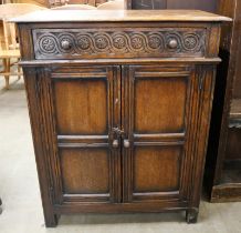 A 17th Century style carved Ipswich oak cupboard