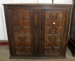 A William III geometric moulded oak two door cupboard