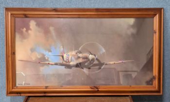 A Barrie A.F. Clark print of a Spitfire, framed