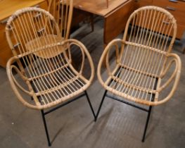 A pair of Italian style wicker chairs