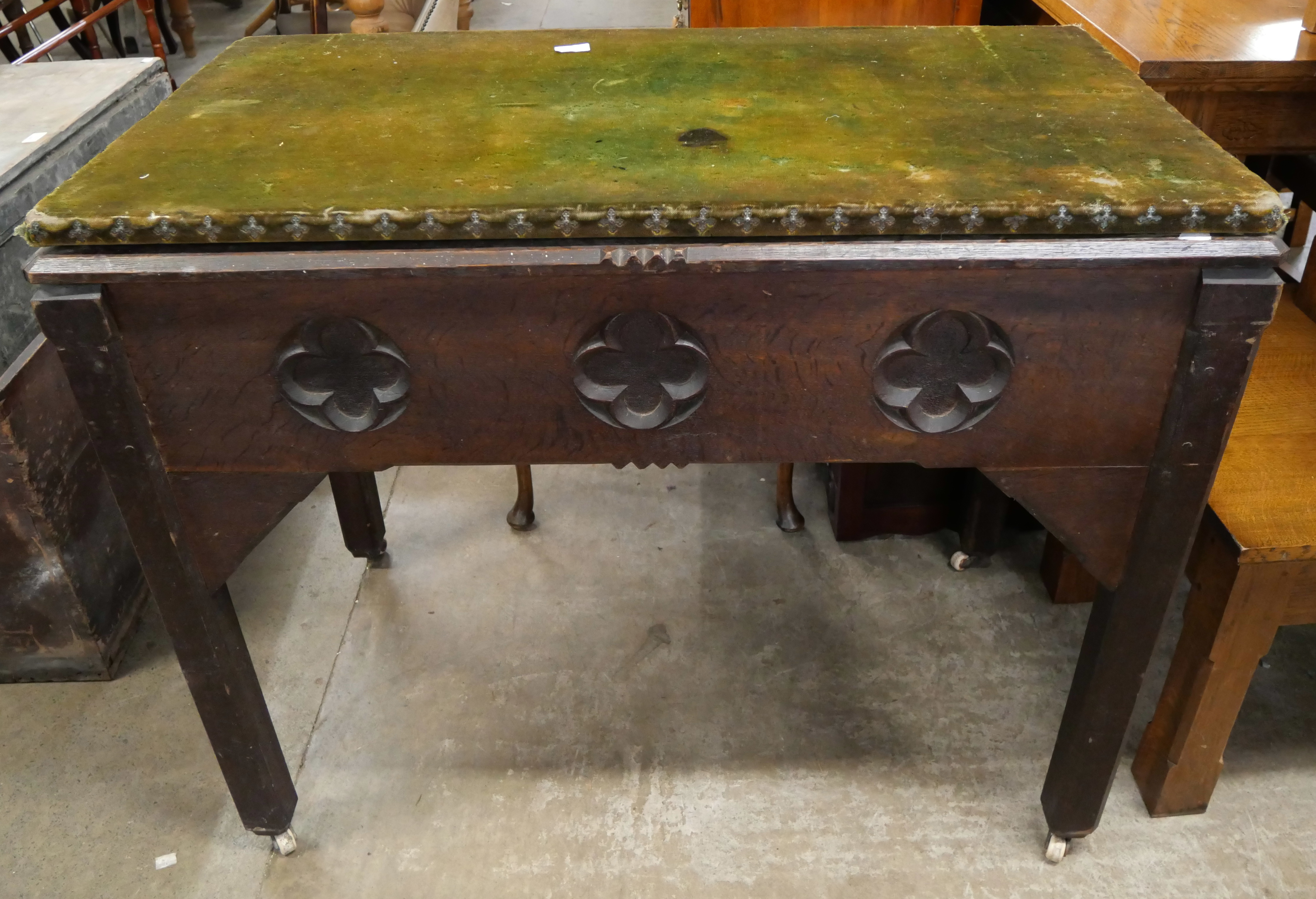 A Victorian Gothic Revival carved oak side table