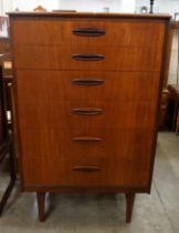 A teak chest of drawers