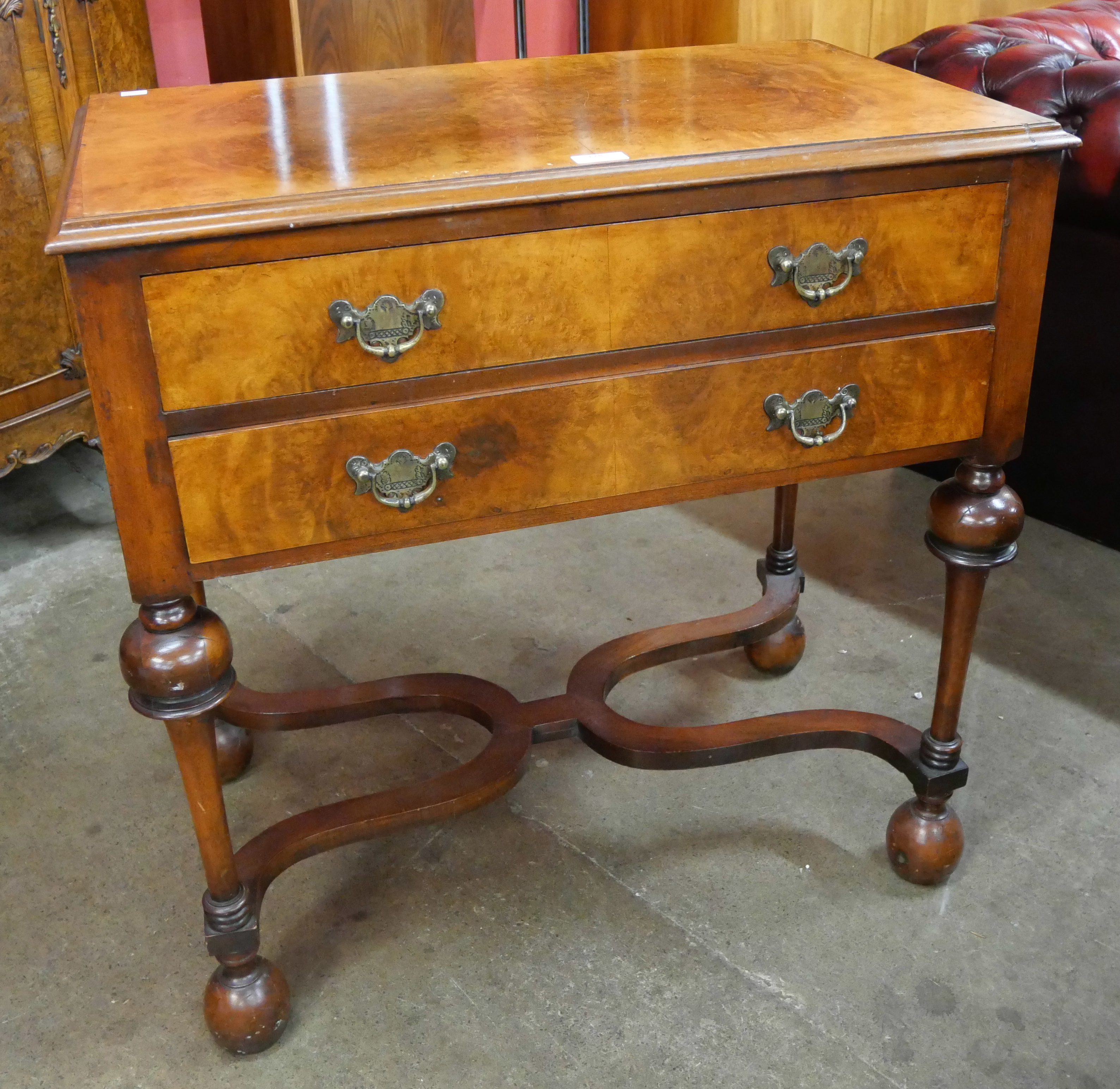 A George I style burr walnut two drawer side table