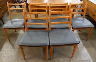 A set of six teak dining chairs