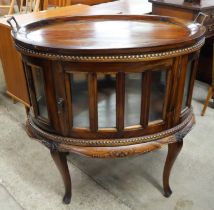 A Dutch style hardwood oval glass drink's cabinet