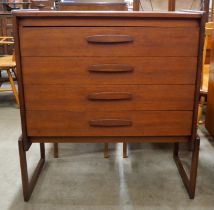 A teak chest of drawers