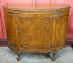 A Queen Anne style burr walnut demi-lune side cabinet