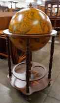 An Italian terrestrial globe cocktail cabinet/trolley