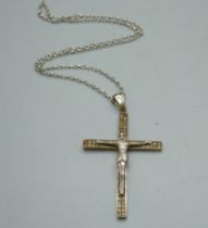 A silver gilt crucifix set with cubic zirconia, on a silver chain, 14g, pendant length 7.5cm