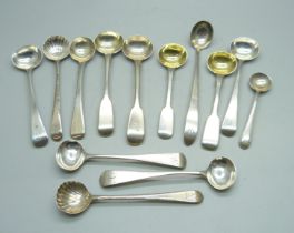 A collection of silver condiment spoons including a Victorian mustard spoon by George Adams, 136g