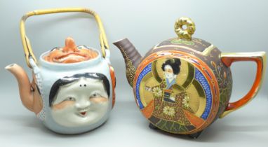 A Japanese 19th Century Banko teapot with Noh masks to four sides and lid, old damge and repairs,