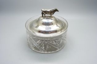 A silver topped glass dish with bull detail, top 83g