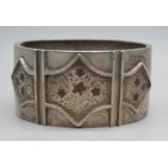 A Victorian engraved silver cuff bangle with floral detail, the clasp marked Sterling Silver, 38g