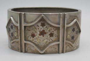 A Victorian engraved silver cuff bangle with floral detail, the clasp marked Sterling Silver, 38g