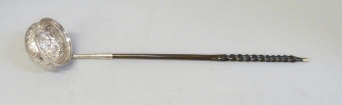 A toddy ladle with baleen handle, the bowl inset with a 1720's Brazilian 400 reis gold coin