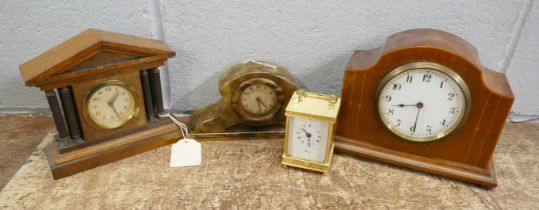 An Edwardian inlaid clock, brass timepiece and two other clocks