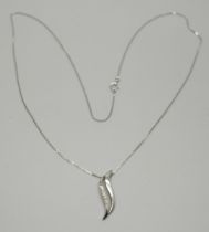 An 9ct white gold pendant set with six diamonds, on a 9ct gold chain, 1.5g