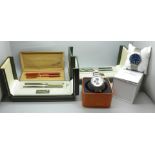 Two wristwatches, Skagen and Fossil and three Elysee pen sets