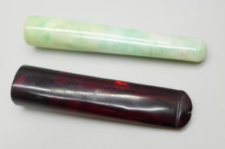 Two cigarette/pipe holders; one jadeite and one amber (a/f)