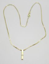 An 18ct gold and diamond pendant on a 9ct gold chain, total weight 3.7g, chain 41cm