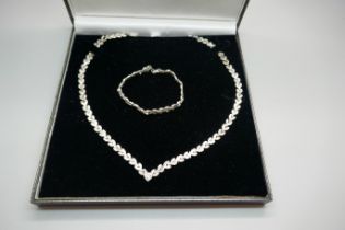 A silver necklace and bracelet set, boxed, 33g