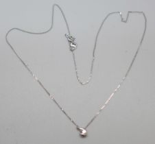 A 9ct white gold and diamond pendant on a fine 9ct white gold chain, 0.9g, chain 41cm, with Canadian