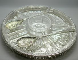 An English silver plate hors d'oeuvres set with seven cut glass dishes and silver plate tray and