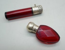 A Victorian silver and faceted red glass scent bottle, Birmingham 1896, top a/f, and one other