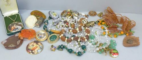 A collection of costume jewellery, including brooches and necklaces