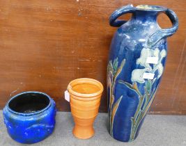 A large Art Nouveau pottery vase, rim restored, a Bretby planter, restored and an orange Branham