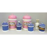 A collection of ceramic apothecary jars, three named, three lids a/f