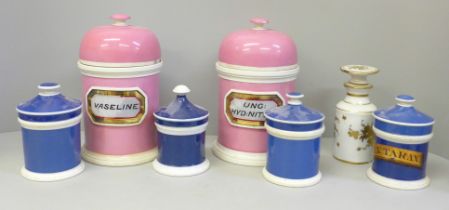 A collection of ceramic apothecary jars, three named, three lids a/f