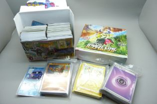 500+ Pokemon cards including Black Star rares and holographic cards in protective sleeves, cards