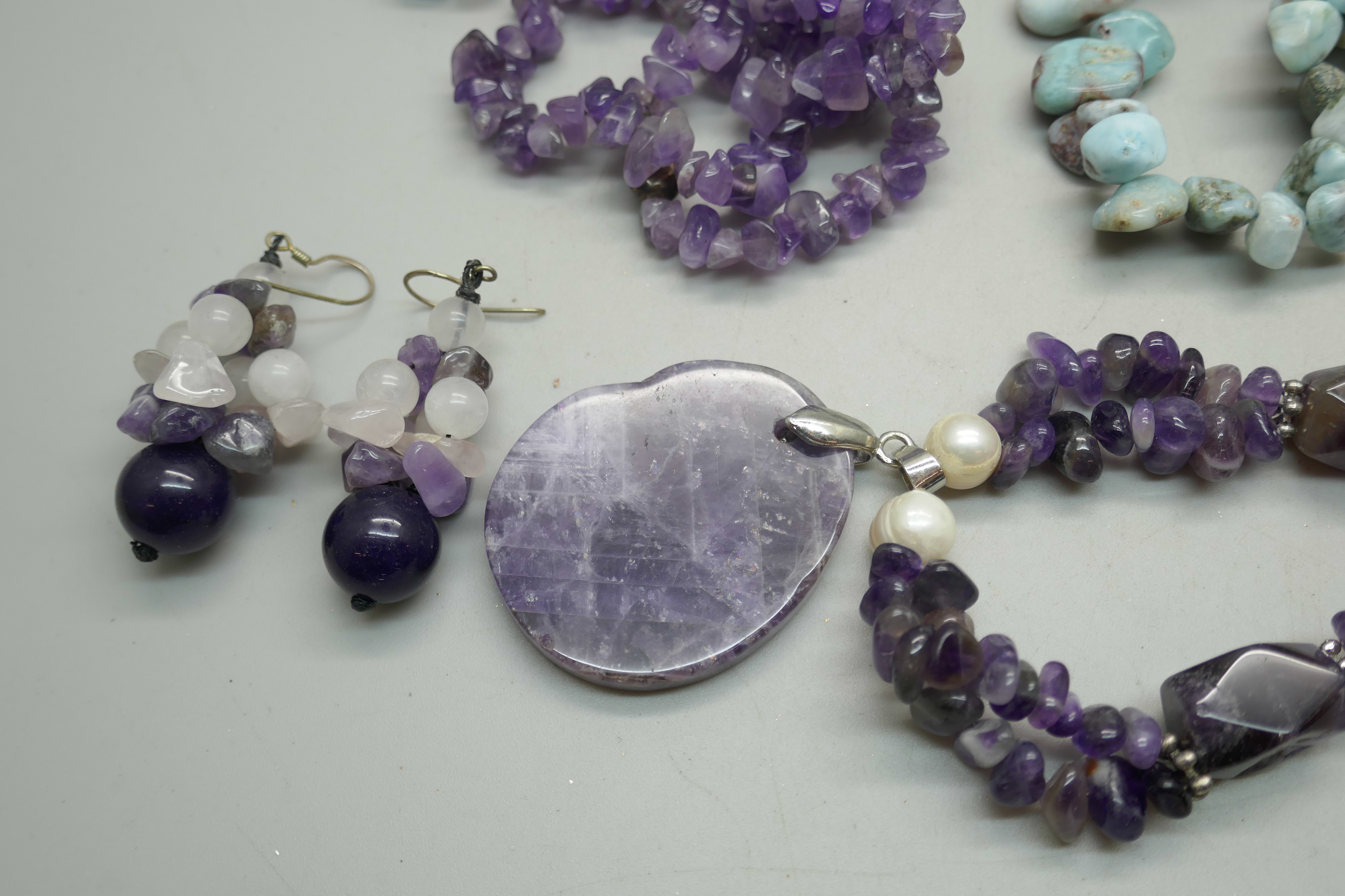 A turquoise seven strand necklace with silver clasp, two amethyst necklaces, one with earrings, a - Image 2 of 3