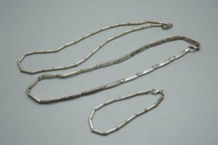 A silver bracelet and necklace set and another silver necklace, 66g