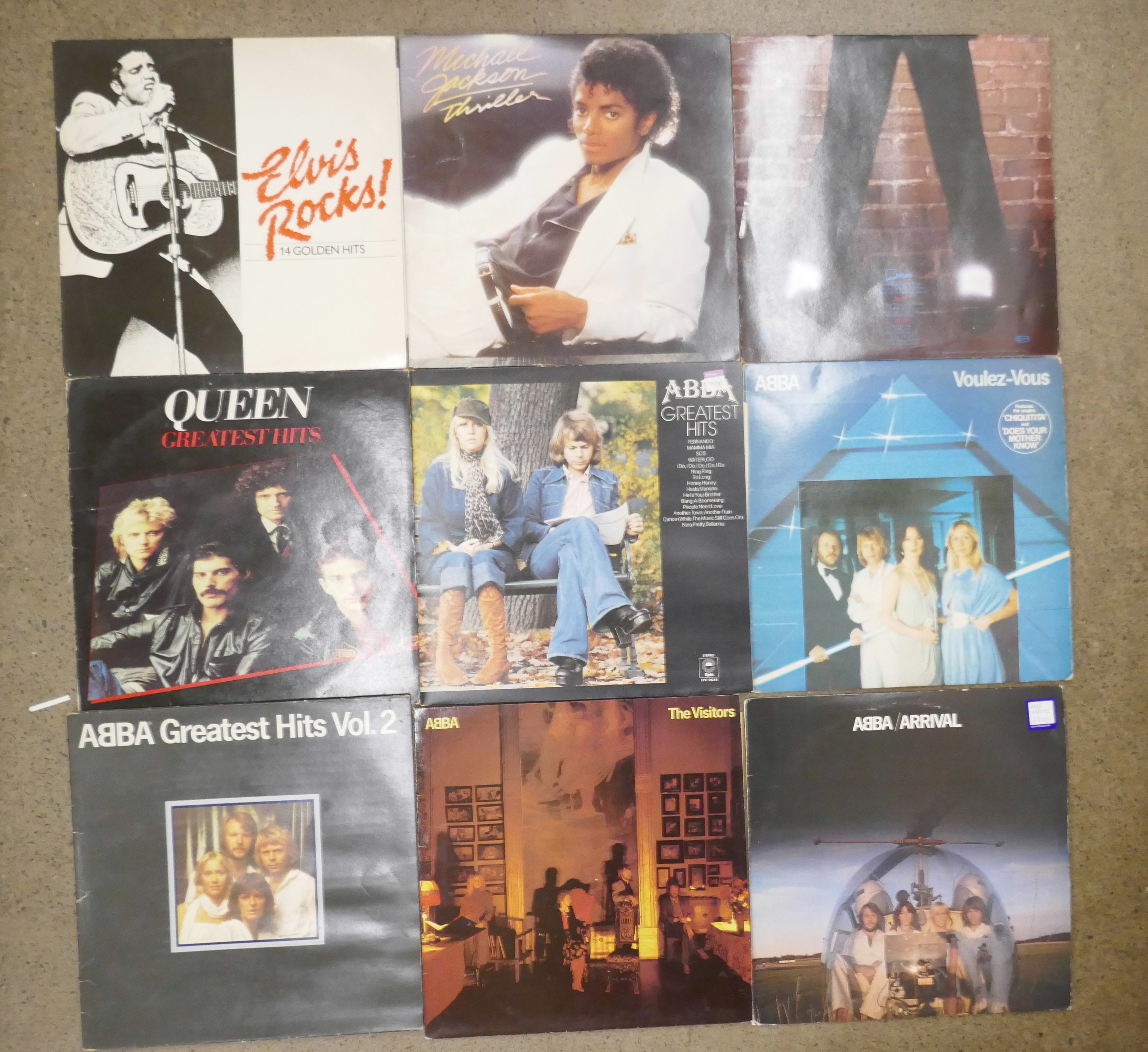 A box of LP approximately 55 records; ABBA, Elvis Presley, Queen, Billy Joel, Level 42, etc.