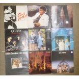 A box of LP approximately 55 records; ABBA, Elvis Presley, Queen, Billy Joel, Level 42, etc.