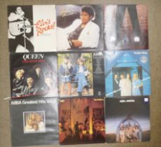 A box of LP approximately 55 records; ABBA, Elvis Presley, Queen, Billy Joel, Level 42, etc.