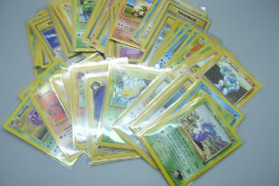 Ninety vintage Pokemon cards, sets Fossil base set, Rocket, base set 2, Jungle, etc.