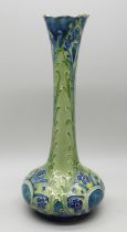 An early William Moorcroft vase, made for Liberty & Co., rim a/f, 18cm