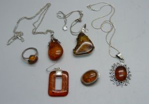 Silver and amber jewellery - three pendants on chains, two single earrings and a ring