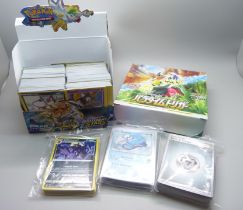 500+ Pokemon cards including Black Star rares and holographic cards in protective sleeves, cards